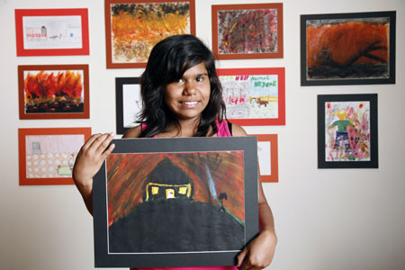 Netty Atkinson with her painting, 'The Disaster'