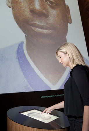 Accessing the images within the large digital mosaic dominating the far wall of the exhibition
