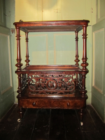 Walnut canterbury with foliate scroll decoration