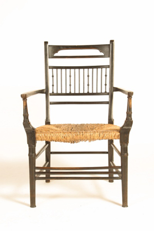 Rush-seated, Anglo-Japanese walnut spindle-backed armchair