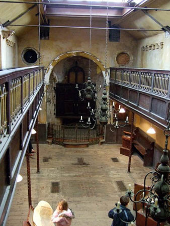 The main area of what was once the old synagogue, viewed from the gallery, with some of the exhibits in the Suitcases and Sanctuary exhibition