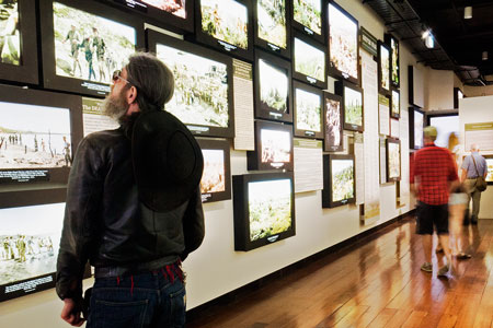 A wall of colourised images bringing Anzac to life, Gallipoli: The New Zealand Story in Colour, Pukeahu National War Memorial Park