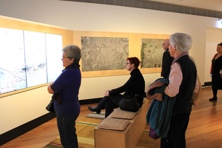 Visitors watching the film Creekology, Navigating Norman Creek, Museum of Brisbane 2015