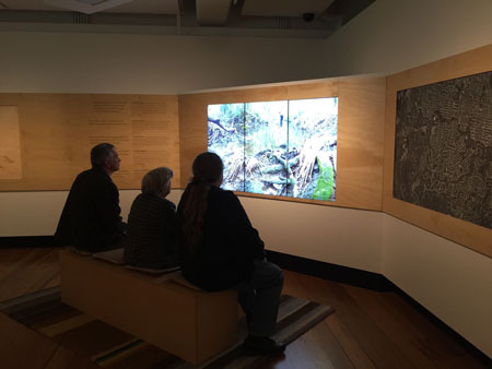 Visitors watching the film Creekology, Navigating Norman Creek, Museum of Brisbane, 2015