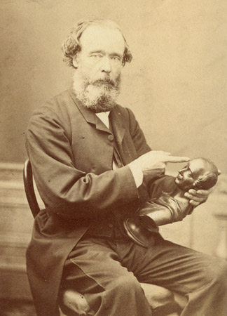 Scottish phrenologist AS Hamilton holding a miniature bust of Prince Albert