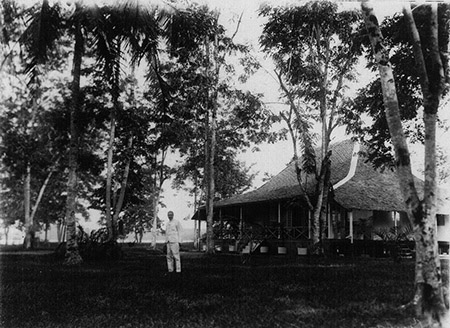 William Louis Abbott in the grounds of a Dutch controleur's house