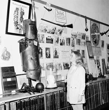 Image of girl looking at replica of Ned Kelly's armour-plated suit, Burke Museum, Beechworth, Vic