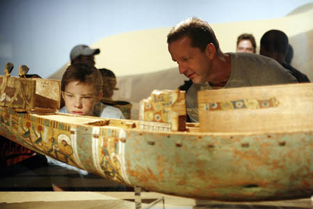 Visitors admire a model river ship