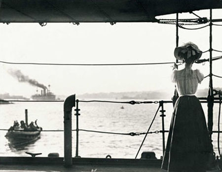 Photo of a woman standing on a boat.