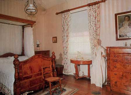 Huon pine bedroom with canopied bed